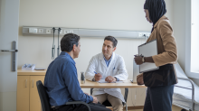 a-consultation-room-in-a-hospital-with-a-doctor-patient-interpreter