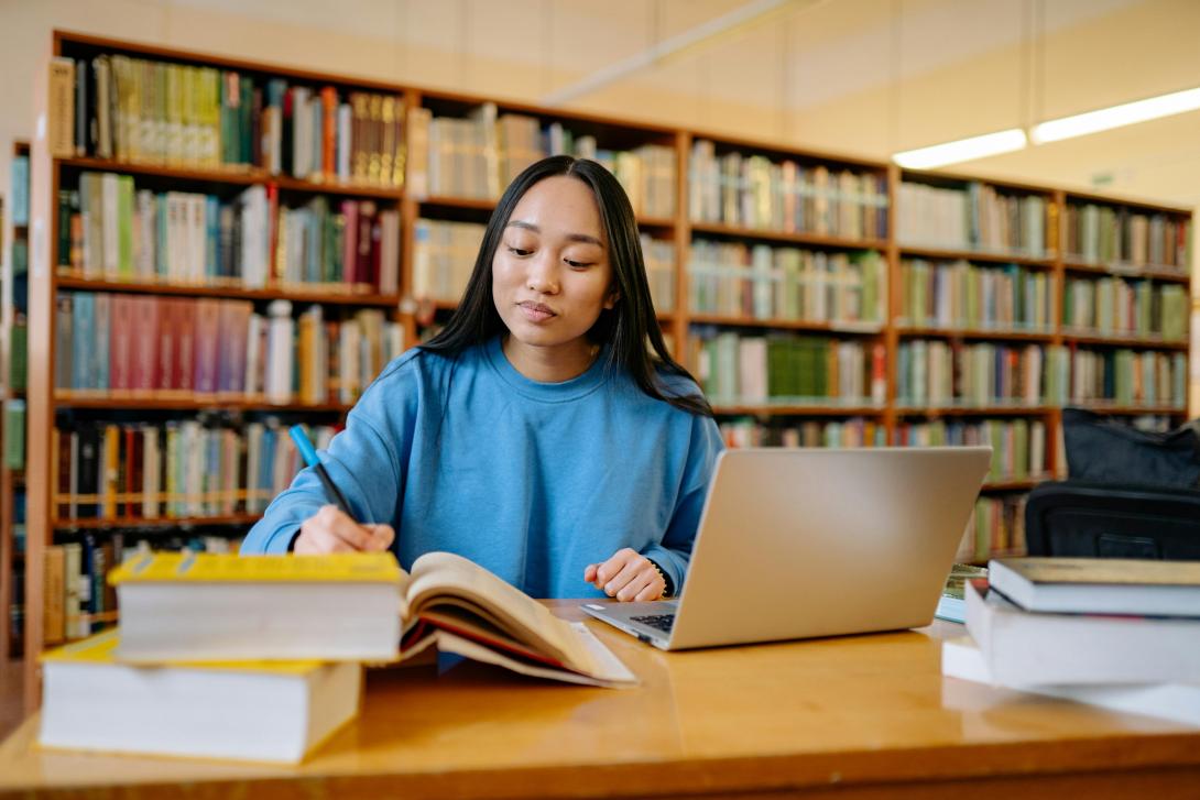 a girl studying in a library