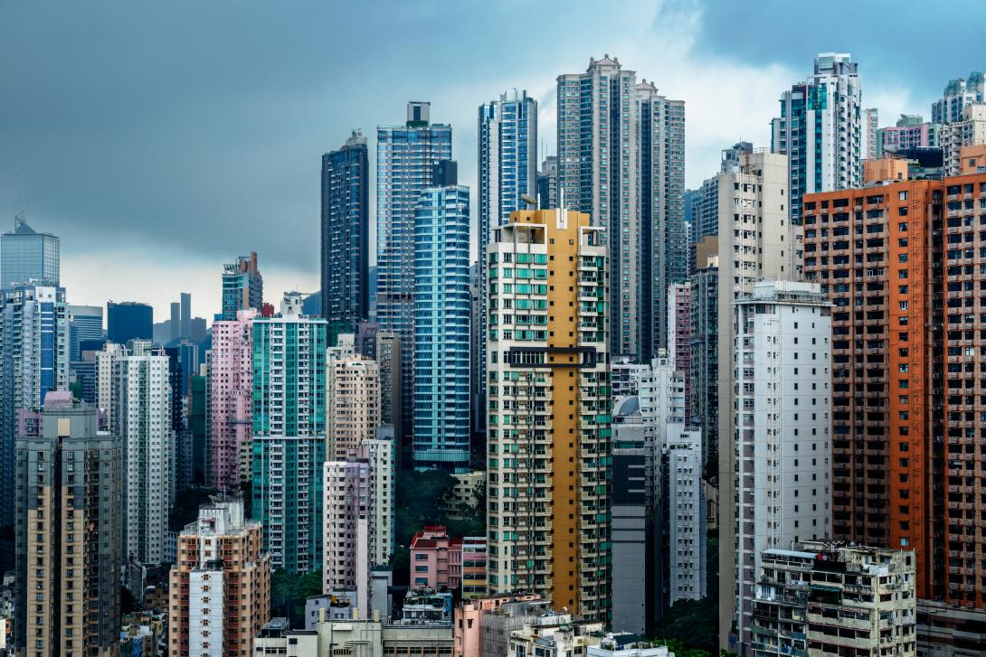 A front view of tall residential towers with modern design, large balconies, and wide spacing between buildings, highlighting comfortable apartment living in East Bangalore.
